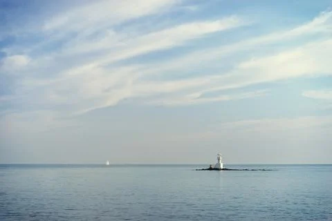 Lighthouse in the sea. Fotos Stock