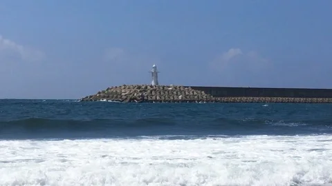 Lighthouse on the sea with waves Video stock 98249069