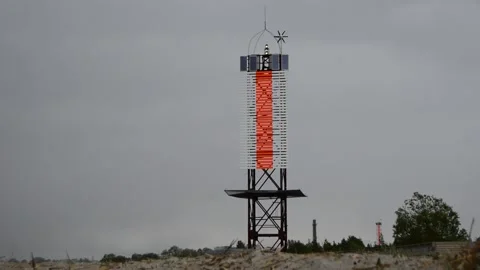 The lighthouse on the seashore is shining Stock Footage 144129703
