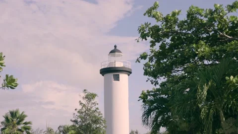 Lighthouse in seaside park in Rincon Puerto Rico at midday Stock Footage 157397474