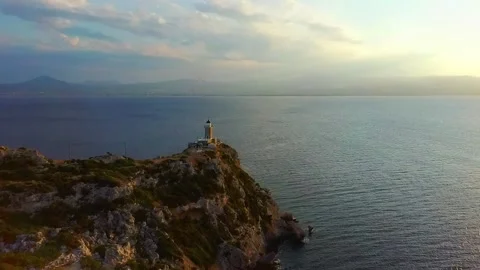 Lighthouse with a seaview at sunset in the aegean Stock Footage 159385510