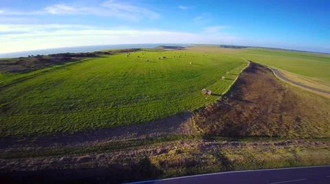 Lighthouse at Seven Sisters Cape captured from Beachy Head (aerial) Stock Footage 45425832