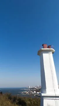 The lighthouse on the shore Stock Photos