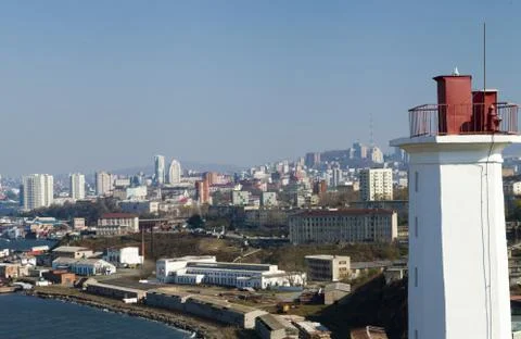 The lighthouse on the shore Stock Photos