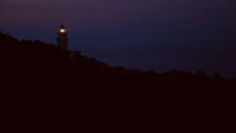 Lighthouse silhouette at night Vídeo Stock 120210699