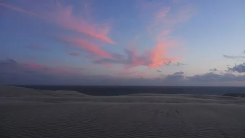 Lighthouse silhouette on sand dune at sunset Stock Footage 338124718