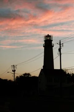Lighthouse Silhouette at Sunset Stock-Fotos