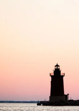 Lighthouse silhouette vertical Stock Photos