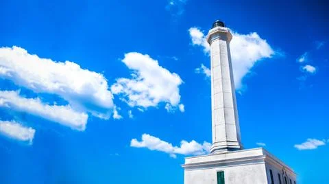 Lighthouse sky background horizontal copy space clouds blue white light Stock Photos