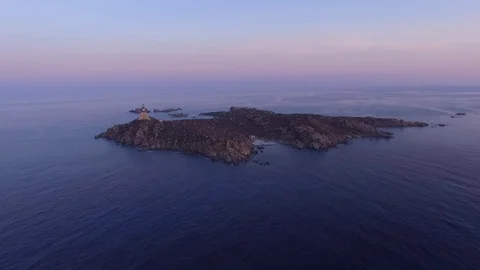 Lighthouse On Small Island In Sunrise Stock Footage 82396876