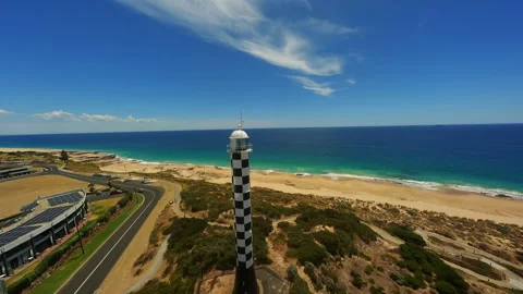 Lighthouse in a small town by the beach in Australia Stock Footage 243729243