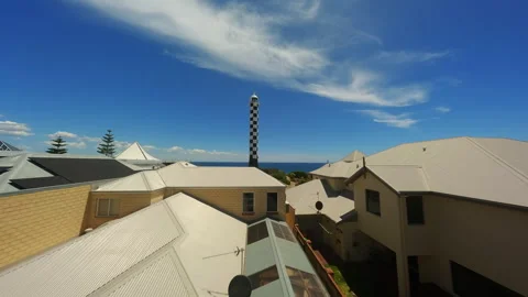 Lighthouse in a small town by the beach in Australia Stock Footage 243729402