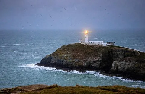 A lighthouse on South Stack, an island situated just off Holy Island on the n Stock Photos