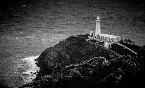 A lighthouse on South Stack, an island situated just off Holy Island on the n Stock Photos