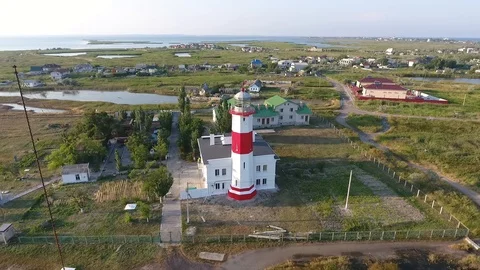 Lighthouse on a spit. Aerial view.  Rounding in a semicircle. Stock Footage 95625286