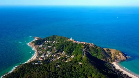 Lighthouse standing on a mountain above a small city in Australia Stock Footage 95898086