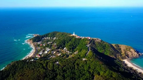 Lighthouse standing on a mountain above a small city in Australia Stock Footage 95898097