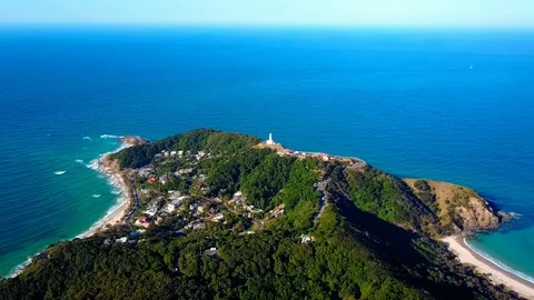 Lighthouse standing on a mountain above a small city in Australia Stock Footage 95898103