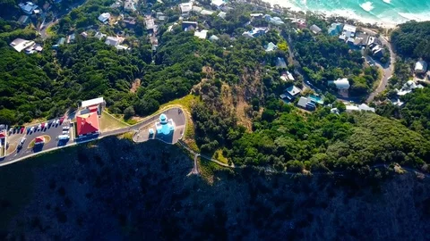 Lighthouse standing on a mountain above a small city in Australia Stock Footage 95898112