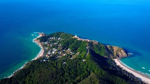 Lighthouse standing on a mountain above a small city in Australia Stock Footage 95898174