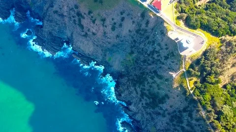 Lighthouse standing on a mountain above a small city in Australia Stock Footage 95898216