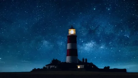 Lighthouse on starry night time lapse Stock Footage 144340649