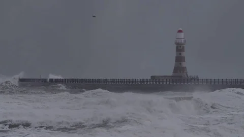 LIGHTHOUSE IN A STORM AT SEA - Slow motion Stock Footage 71398557