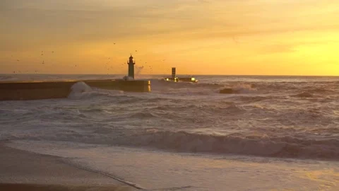 Lighthouse In Stormy Landscape. Big Waves. Sunset.  Video stock 229112977
