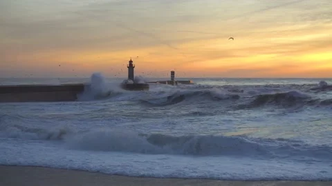 Lighthouse In Stormy Landscape. Big Waves. Sunset. Stockbeeldmateriaal 229533524