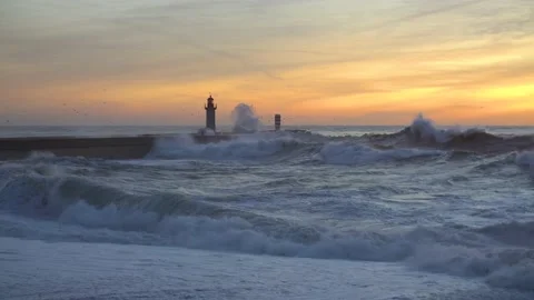 Lighthouse In Stormy Landscape. Big Waves. Sunset. Stockbeeldmateriaal 229533577