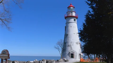 Lighthouse on a Sunny Day 4k Stock Footage 128157379
