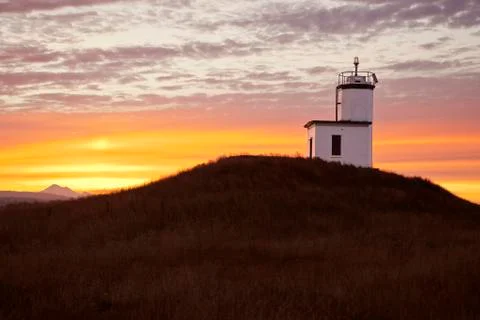 Lighthouse at sunrise Stock Photos