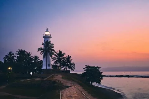 Lighthouse at sunrise Stockfoto's