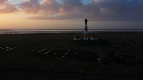 Lighthouse at sunset, aerial panoramic view Stock Footage 123757297