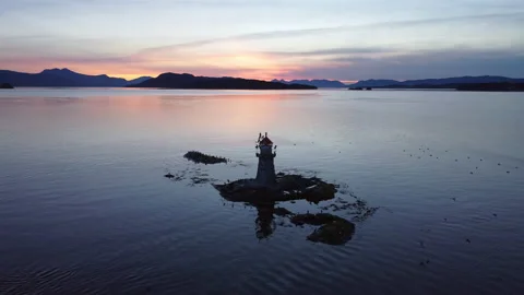 Lighthouse at sunset aerial shot Stock Footage 218255127