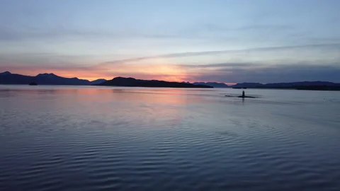 Lighthouse at sunset aerial shot Stock Footage 218255499