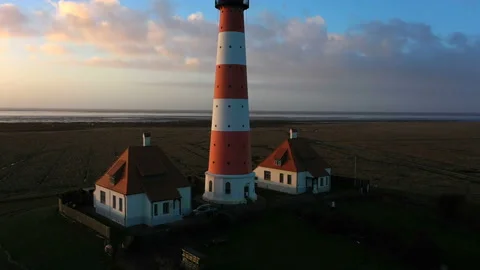 Lighthouse at sunset, aerial view Stock Footage 123733349