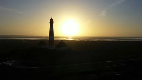 Lighthouse at sunset, aerial view, silhouette Stock Footage 123712288