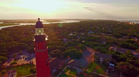 Lighthouse at sunset by Atlantic ocean Stock Footage 54940393