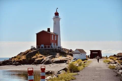 Lighthouse at sunset landscape Stock Photos