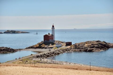 Lighthouse at sunset landscape Stock Photos