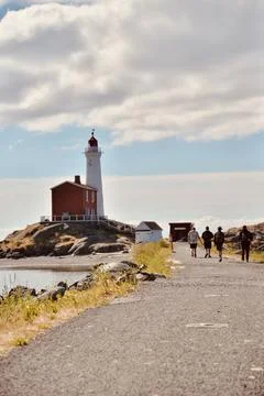 Lighthouse at sunset landscape Fotos Stock
