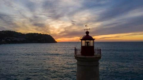 Lighthouse at sunset, Majorca, Spain Stock Photos