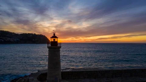Lighthouse at sunset, Majorca, Spain Stock Photos