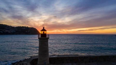 Lighthouse at sunset, Majorca, Spain Stock Photos
