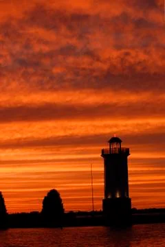 Lighthouse sunset Stock Photos