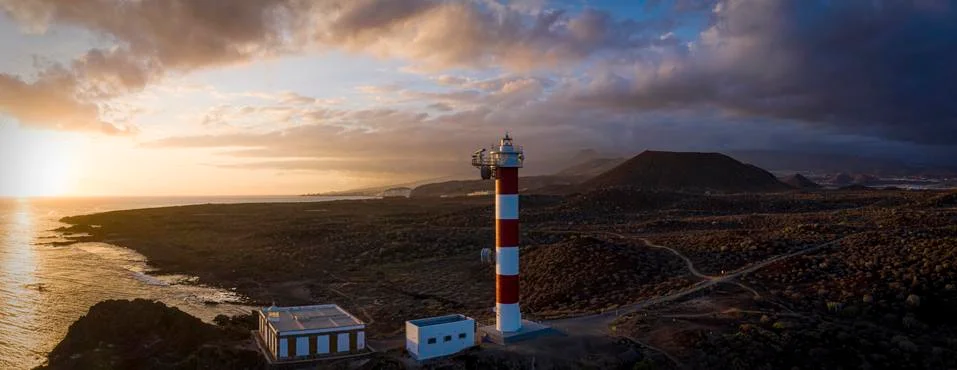 Lighthouse at the sunset Stock Photos