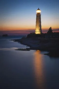 Lighthouse at sunset Stock Photos