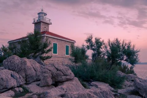 Lighthouse in sunset Stock Photos