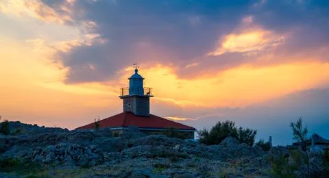 Lighthouse in sunset Stock Photos